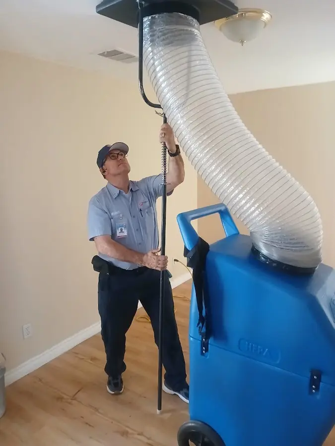 Furnace Tune-Up technician using HEPA equipment in Cuyahoga Falls